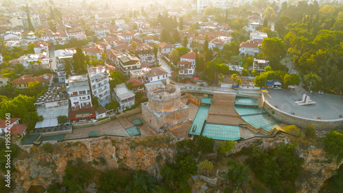 Wallpaper Mural Antalya, Turkey. Aerial drone approach from Mediterranean Sea towards historic Hidirlik Tower standing on cliff edge in morning light.. Aerial View Torontodigital.ca