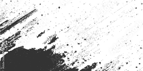 Ink-splattered surface texture. A close-up monochrome shot of abstract ink blot and splatter on paper creating a dramatic design with organic shape.
