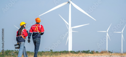 couple engineer team inspection check control wind power machine construction installation in wind energy factory. Two technician professional worker discussion for maintenance wind power turbine
