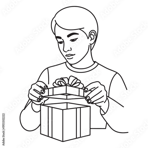 Young man carefully wrapping a gift box with ribbon for special occasion