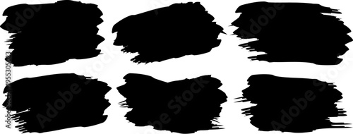 Set of black grunge paint brush strokes, artistic ink splatters and textured stains