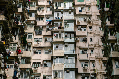 Monster Building (Yick Cheong Building) facade with dense apartments, balconies, air conditioners and hanging laundry