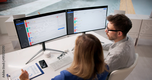 Obraz na plátně Team Overseeing Remote IT Support Tickets To Maintain System Compliance