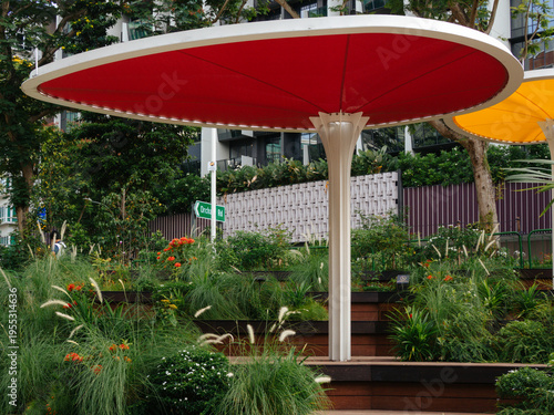 Photography Vibrant Red Shade Canopy in Urban Community Garden at the Temasek Shophouse, Orc