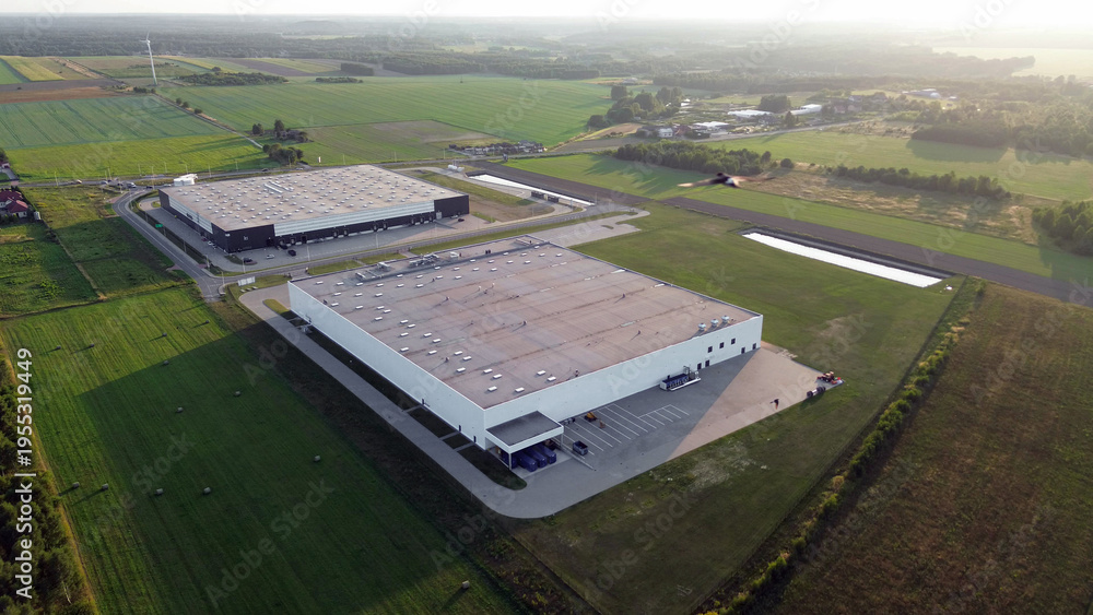 Fototapeta premium Industrial complex in rural area at dawn