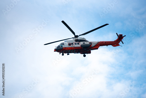 Φωτογραφία Rescue helicopter emergency helicopter red helicopter search and rescue flying a