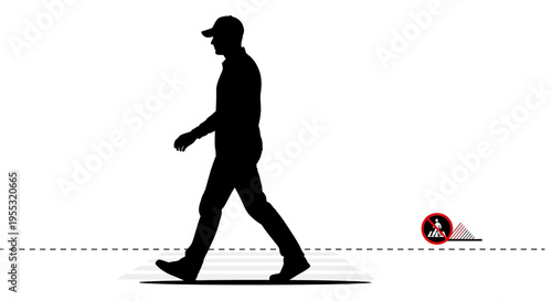 Man walking past a warning sign on the ground with caution tape