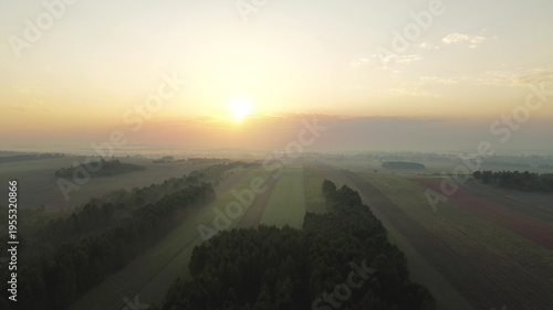 Photos Sunrise fog over colorful autumn forest and fields