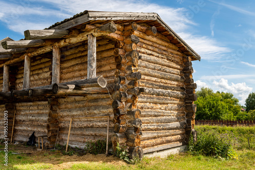 Canvas Print The impressive wooden walls of a reconstructed Old Slavic fortress, made of round, hewn logs