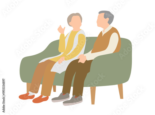 ソファに座って会話するシニア夫婦 高齢者の日常シーン