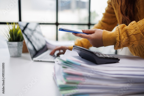 An artistic depiction of a woman engaged with her colorful paperwork and laptop, emphasizing the importance of organization in a professional home office environment.