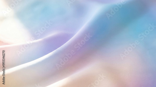 Soft focus close-up photograph of elegant pastel fabric, creating a dreamy abstract background.