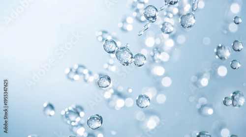 Cuadro en lienzo Refreshing clear water drops and bubbles captured in motion against a soft blue background