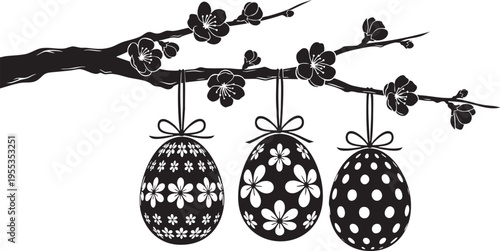 Easter eggs hanging on a blooming cherry tree branch