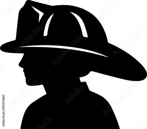 A firefighter wearing a helmet is viewed from the side in profile