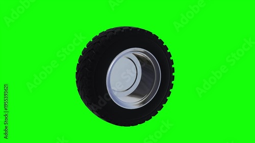 Automotive Wheel on Green: A sleek and durable automotive wheel spins against a vibrant green backdrop, showcasing its design and texture.