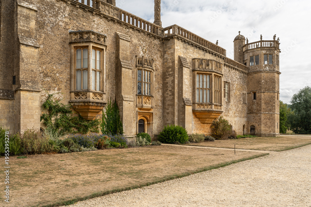 Fototapeta premium Ornate Tudor facade of Lacock Abbey with ornate bay windows, Wiltshire, England