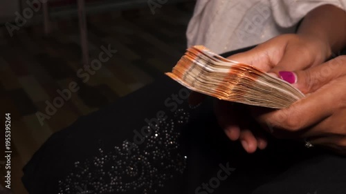 Close up of hands counting Indian rupee notes. Financial transaction concept showing cash handling, savings, economy, income, and money management in India. Ideal for banking and business themes.