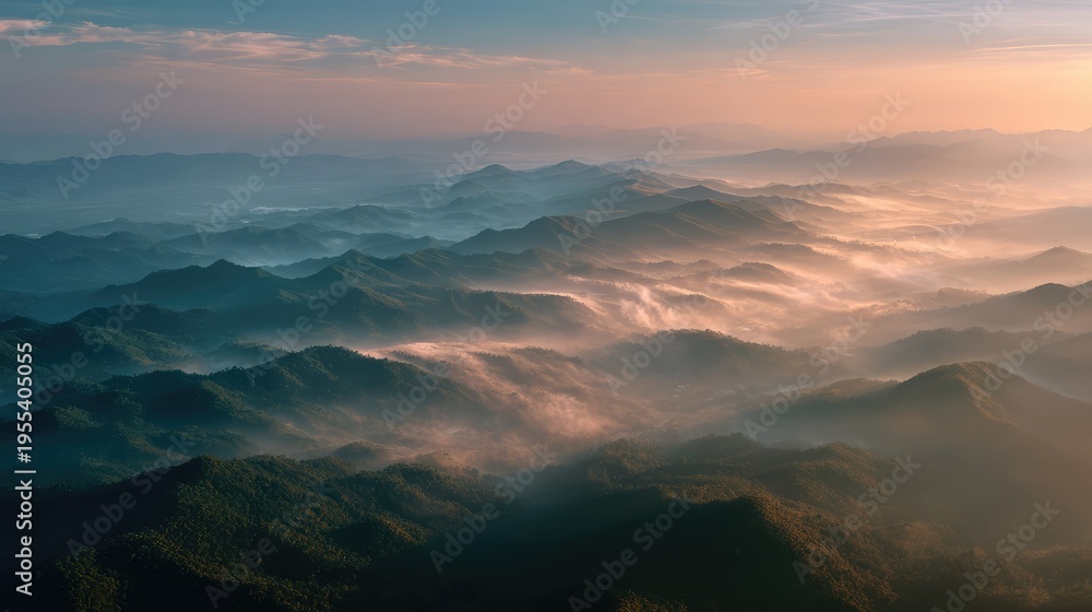 Fototapeta premium Breathtaking Aerial View of Serene Mountain Landscape with Mist and Soft Sunlight at Dawn Overrolling Hills and Valleys in Nature's Tranquil Beauty