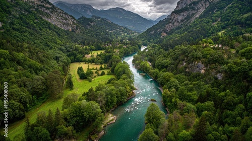 Serene Aerial View of Lush Green Valley with Flowing River Under Cloudy Sky, Surrounded by Majestic Mountains and Vibrant Nature in Scenic Landscape
