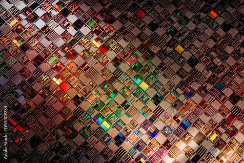 Silicon semiconductor wafer with integrated circuit die mosaic pattern.