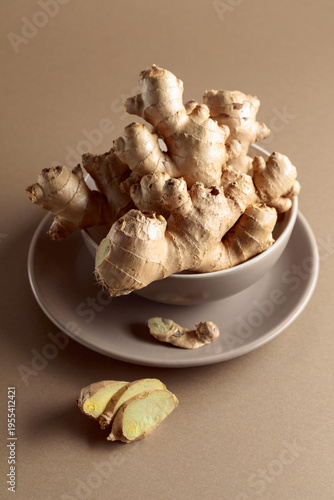 Ginger root on a beige background.