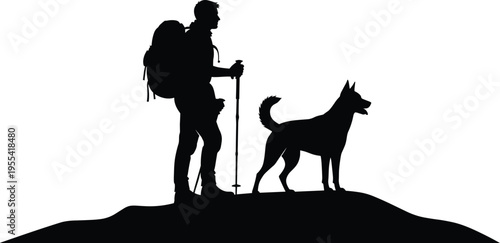 Silhouette of a Male Hiker with Backpack and Trekking Poles Standing on Mountain Peak with his Faithful Dog Friend during Sunset Adventure Trip