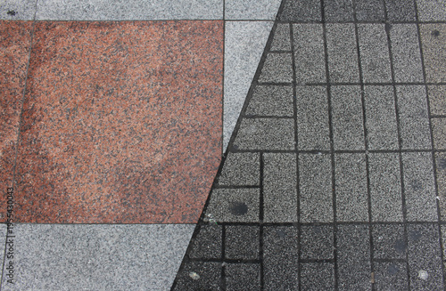 Texture of red, grey and brown square paving tile. Pattern of sidewalk tiles in the street. Concrete pavers close up background.