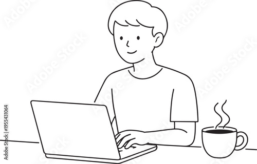 A young man works on a laptop with a cup of steaming coffee beside him