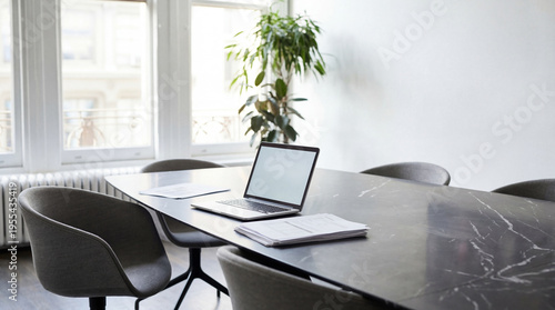 Foto Professional photo of a modern, unoccupied office conference room with a sleek marble table, an open laptop