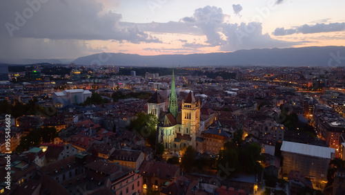 Golden evening over Geneva. Calm twilight at Geneva with reflections and mountain silhouette