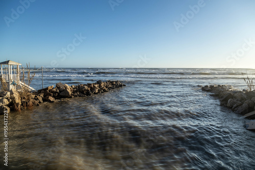 Bilde på lerret Powerful river mouth meeting Mediterranean sea after storm with high water levels