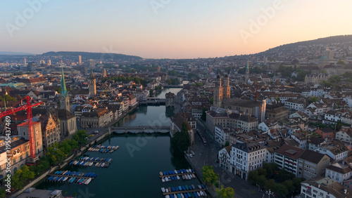Golden cityscape scene. Sunset illuminates historic Zurich with modern and medieval structures