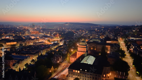 Golden cityscape scene. Sunset illuminates historic Zurich with modern and medieval structures