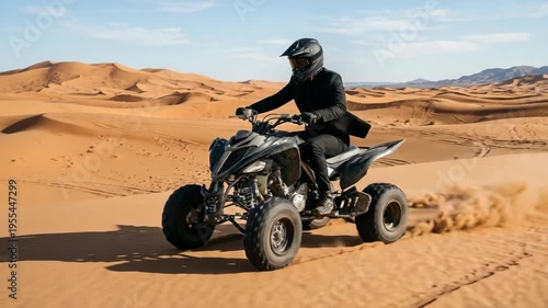 Person in formal wear riding a powerful ATV through vast sand dunes under a clear blue sky.
