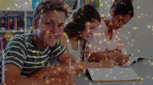 3 students studying as camera pulling left student glancing, yellow node overlay staying over notes