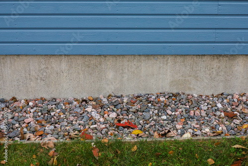 A house foundation with a gravel apron. A drainage layer that diverts water away from the building