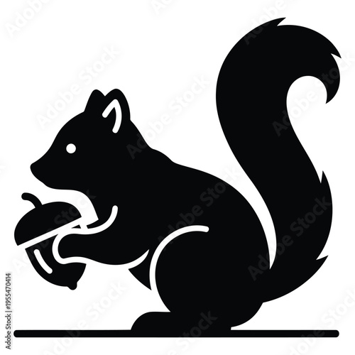 A black and white image of a squirrel holding an acorn