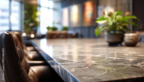 Elegant restaurant interior with marble table and leather chairs.
