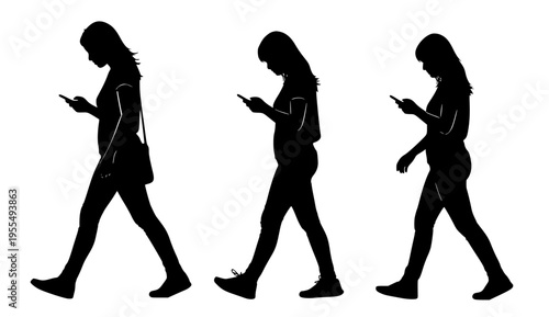 Contemporary Digital Life Silhouettes of Women Walking While Using Mobile Phones, Emphasizing the Concept of Constant Screen Interaction