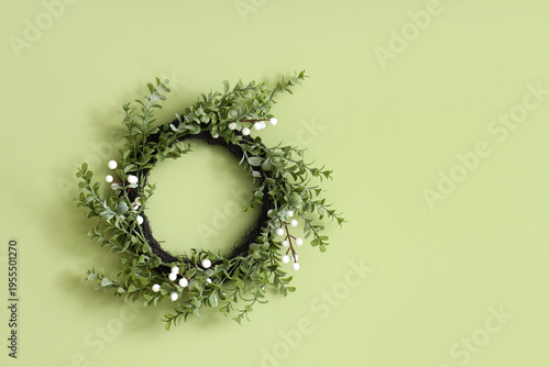 Easter wreath hanging on gr...