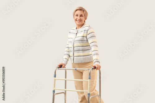 Mature woman with walker on...