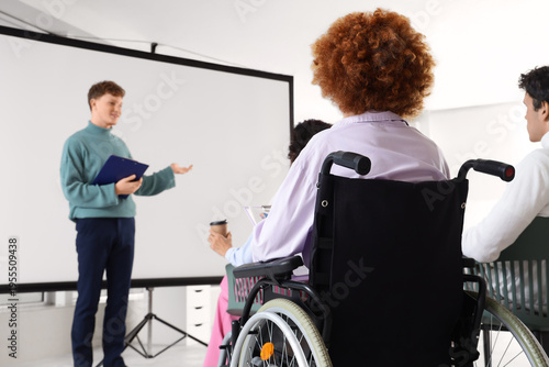 Young woman in wheelchair w...