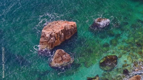 Peaceful turquoise water on the coastline rocky coastline