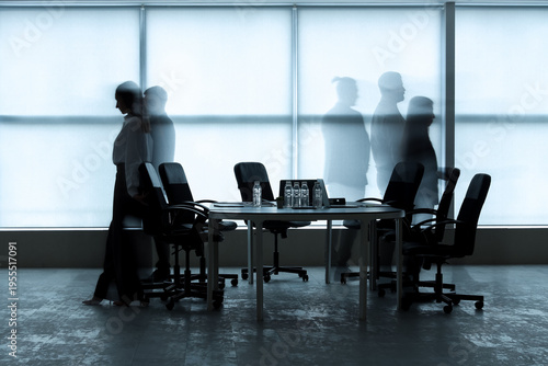 Silhouettes of moving busin...