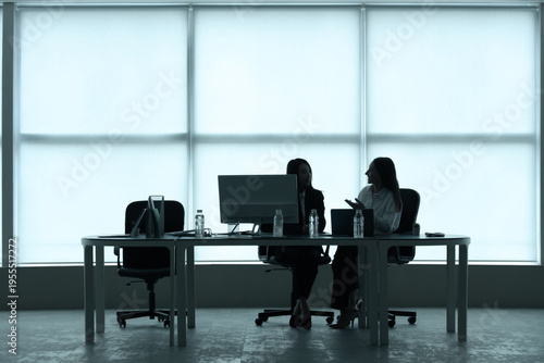 Silhouettes of business wom...