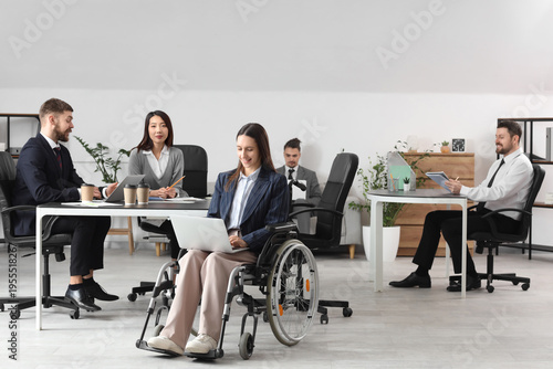 Businesswoman in wheelchair...