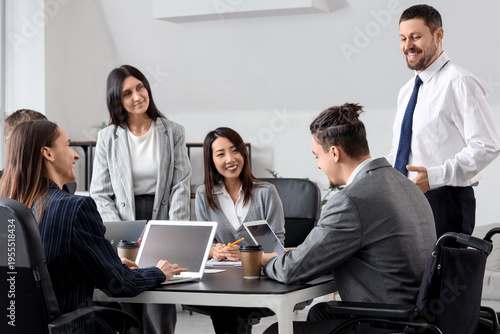 Business people with man in...
