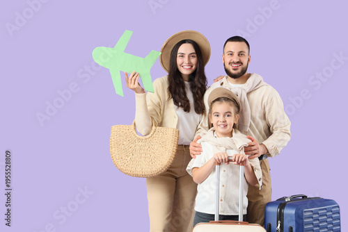 Family of travelers with su...