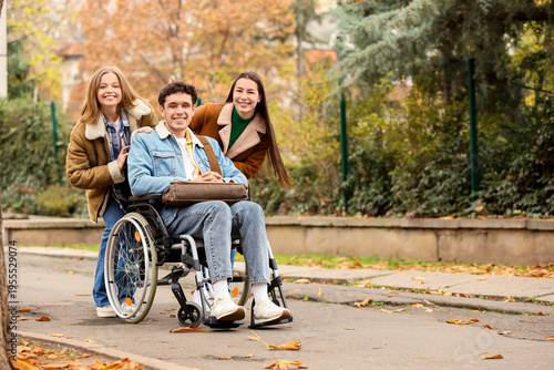 Young man in wheelchair wit...